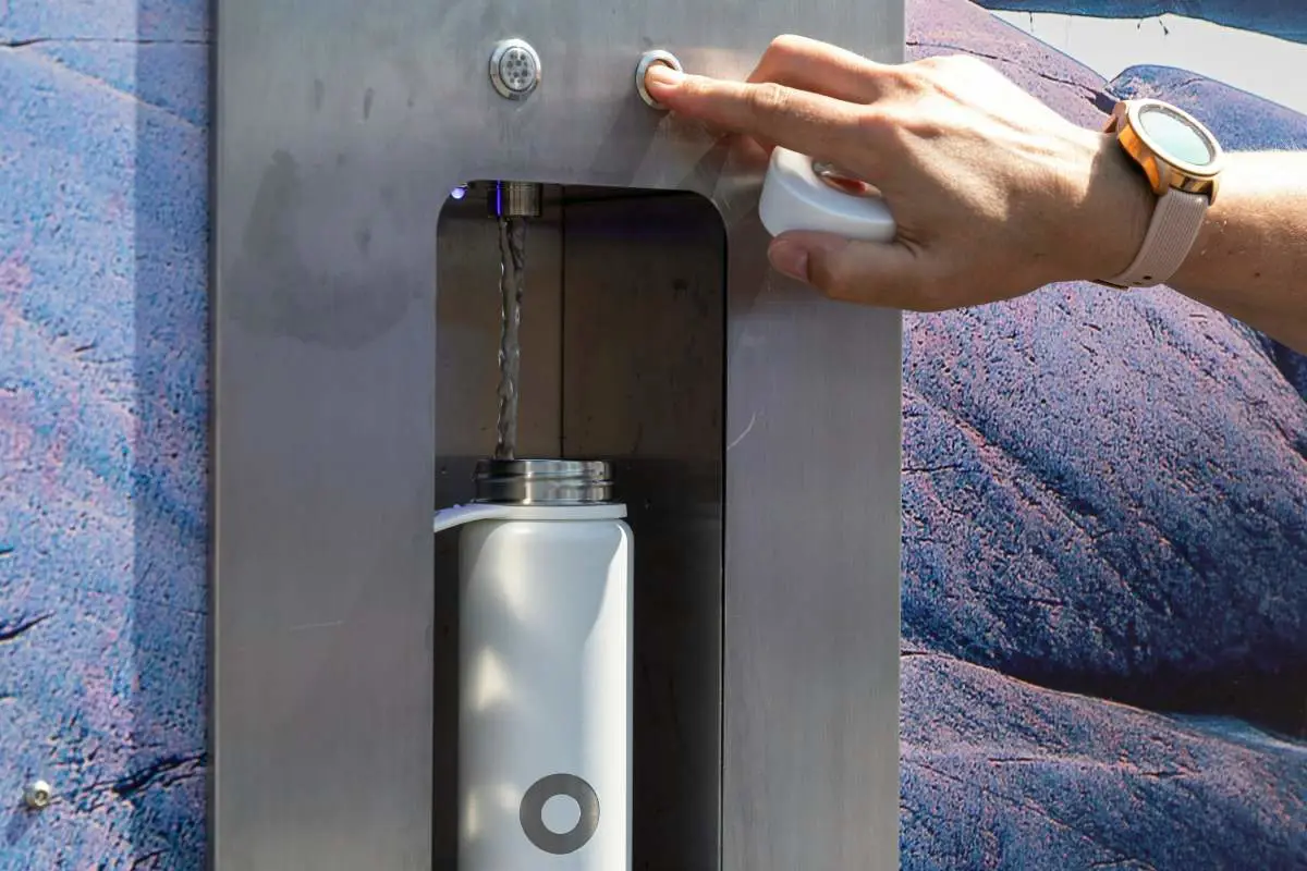 Filling up a reusable water bottle at a filling station in Sweden. Photo by Bluewater Sweden from Unsplash