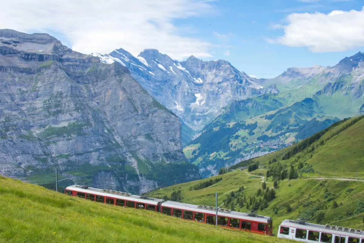 The Jungfraujoch train traversing the mountainous landscapes of Lauterbrunnen, Switzerland. Photo by Hem Poudyal from Unsplash
