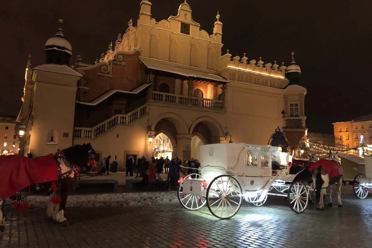 Elegantly lit up horse drawn carriage outside the Christmas market in Krakow Poland. Photo by Becca Marsh