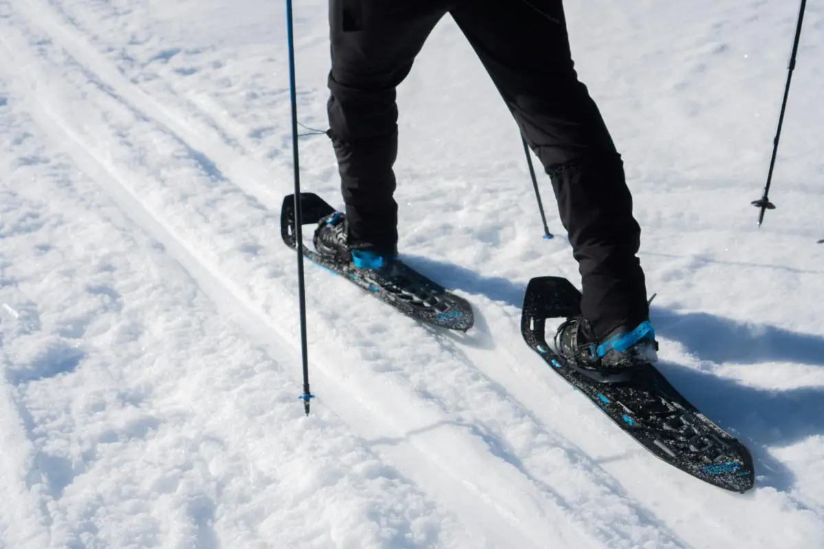 Close Up Of Person Snow Shoeing On Top Of Fresh Snow. Photo By Chewool Kim, Unsplash.
