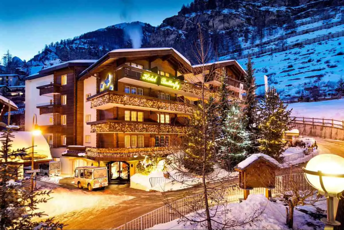 Hotel Butterfly in Zermatt covered in a light dusting of snow at dusk