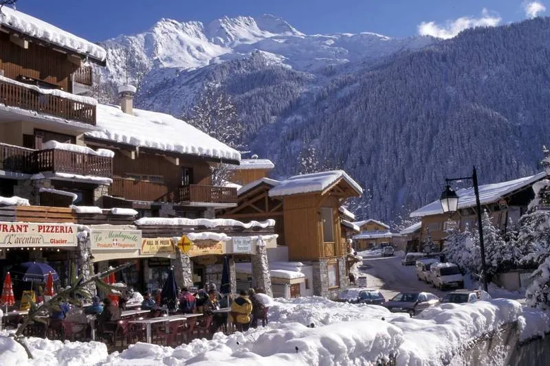 View on Snowy Rooftops Over Bars Restaurants in Laplagne Champagny Ski Resort in France