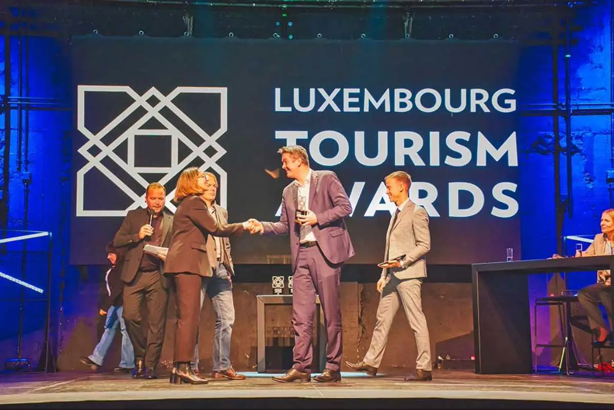Exploreo Co-Founders Priyanka and Arjen collecting their award from Minster Lex Delles for Best Innovation at the Luxembourg Travel Awards in November 2025