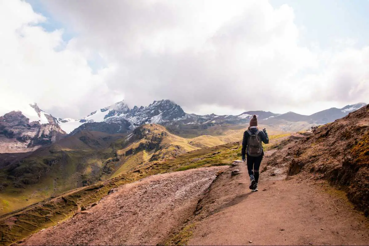 Solo backpacker hiking in the Rainbow Mountains in Peru. Photo by Alvaro Palacios from Unsplash