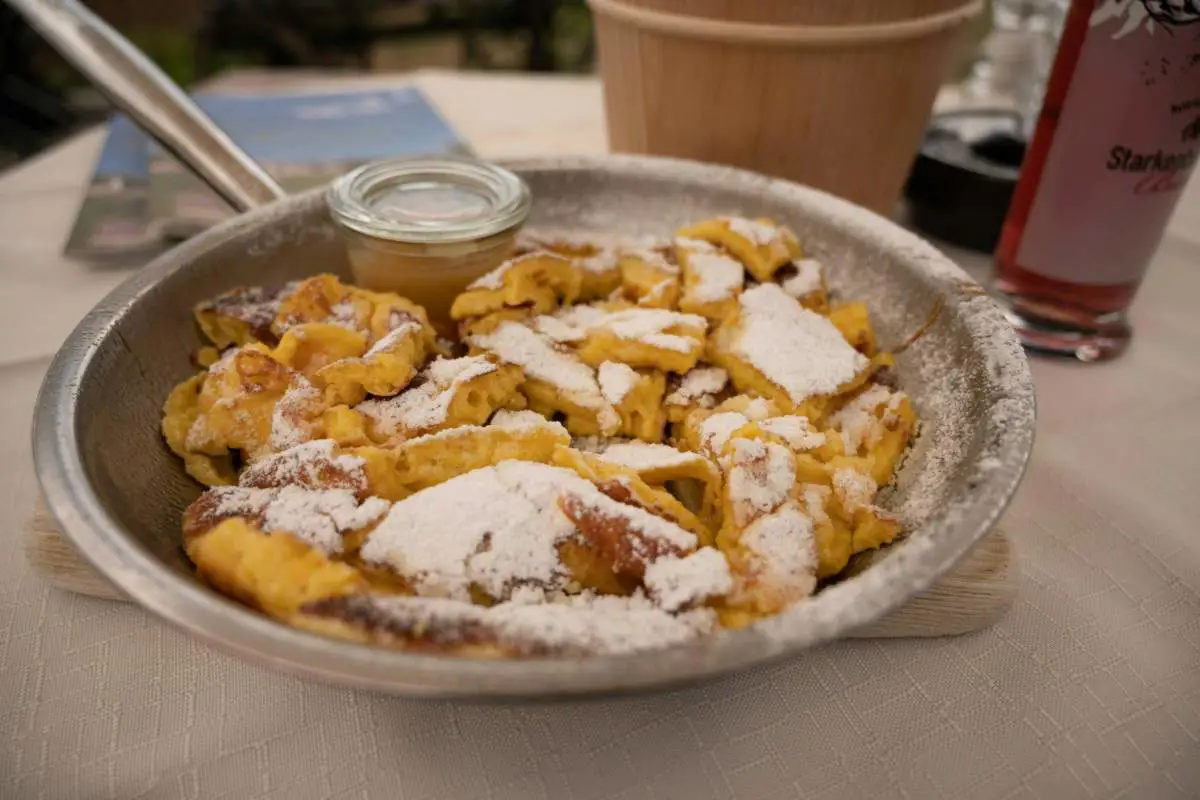 Traditional Austrian dish of Kaiserschmarrn lunch in a pan. Photo by  Babette Landmesser from Unsplash