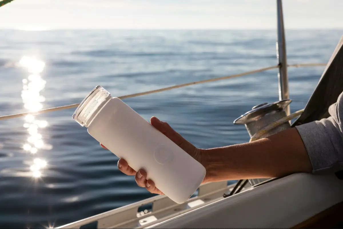 A day on the water in Sweden with a white reusable water bottle. Photo by Bluewater Sweden from Unsplash