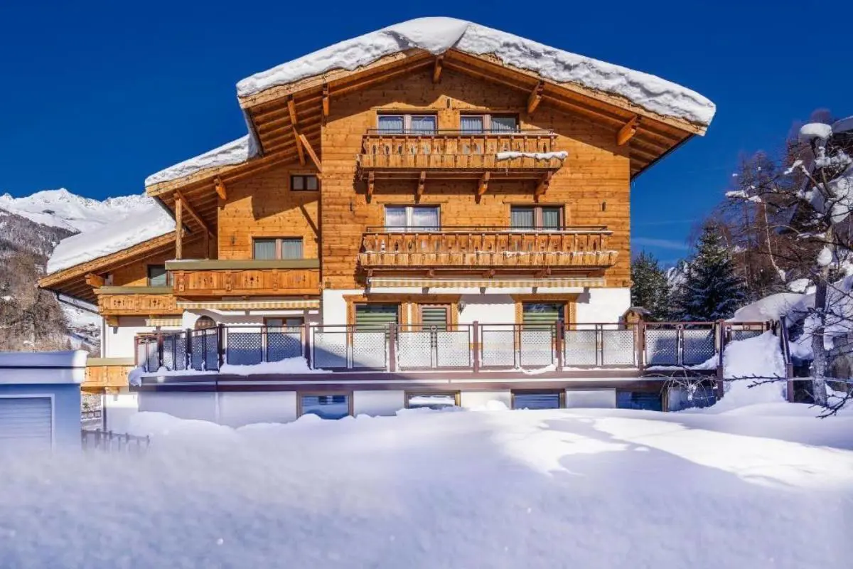 Aliona Apart Hotel surrounded by snowy mountains in Sölden Austria.