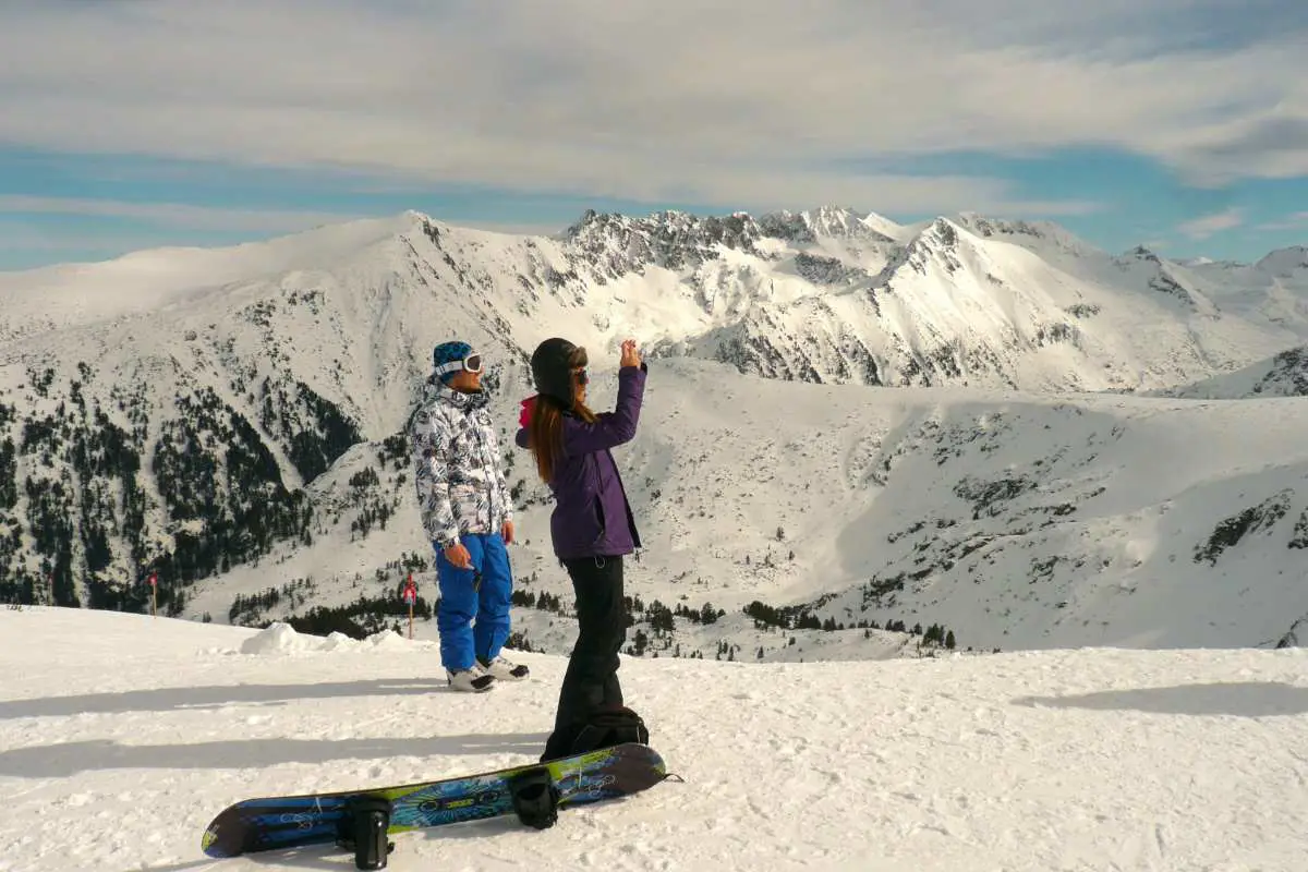 Couple admiring the panoramic views of Bansko ski resort. Photo by Feri and Tasos, Unsplash