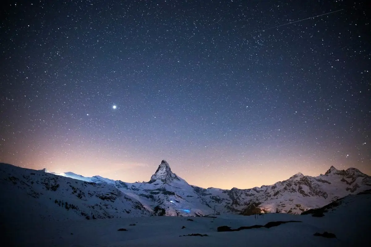 Star gazing with a view of the Matterhorn from Zermatt ski resort in Switzerland. Photo by Explore with Joshua from Unsplash
