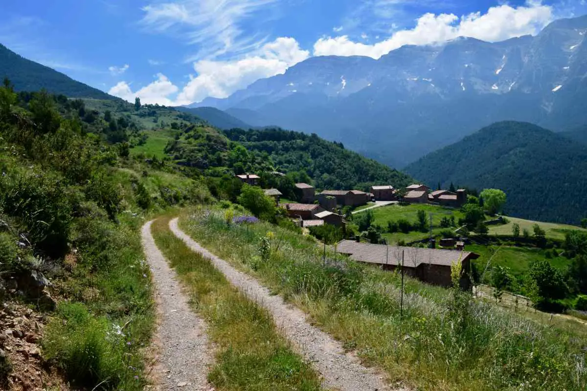 A dusty track running along the Spanish Pyrenees mountains at La Seu d'Urgell, Spain. Photo by Raoul du Plessis from Unsplash