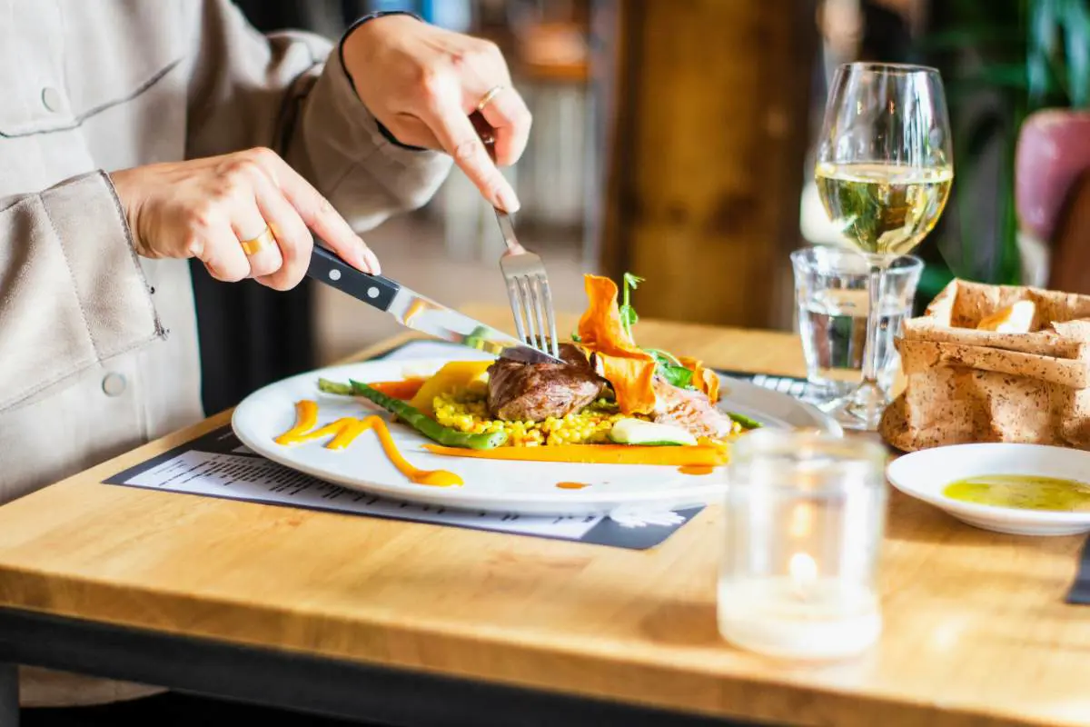 Gourmet dinning experience with wine. Photo by Louis Hansel on Unsplash.