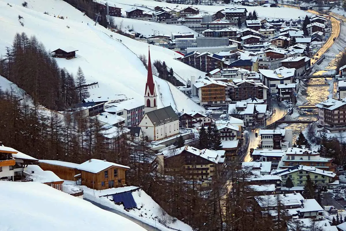 Snow Covered Solden Village in Austria With Church and Mountain View. Photo by Locuig, Pixabay.
